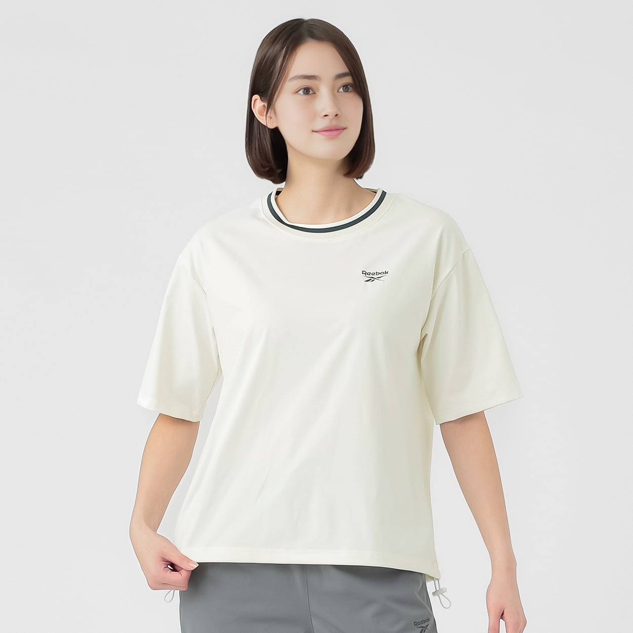 Reebok(リーボック) 裾スピンドルＴシャツ 吸水速乾 肌離れの良い生地使用 レディス(アイボリー-L)